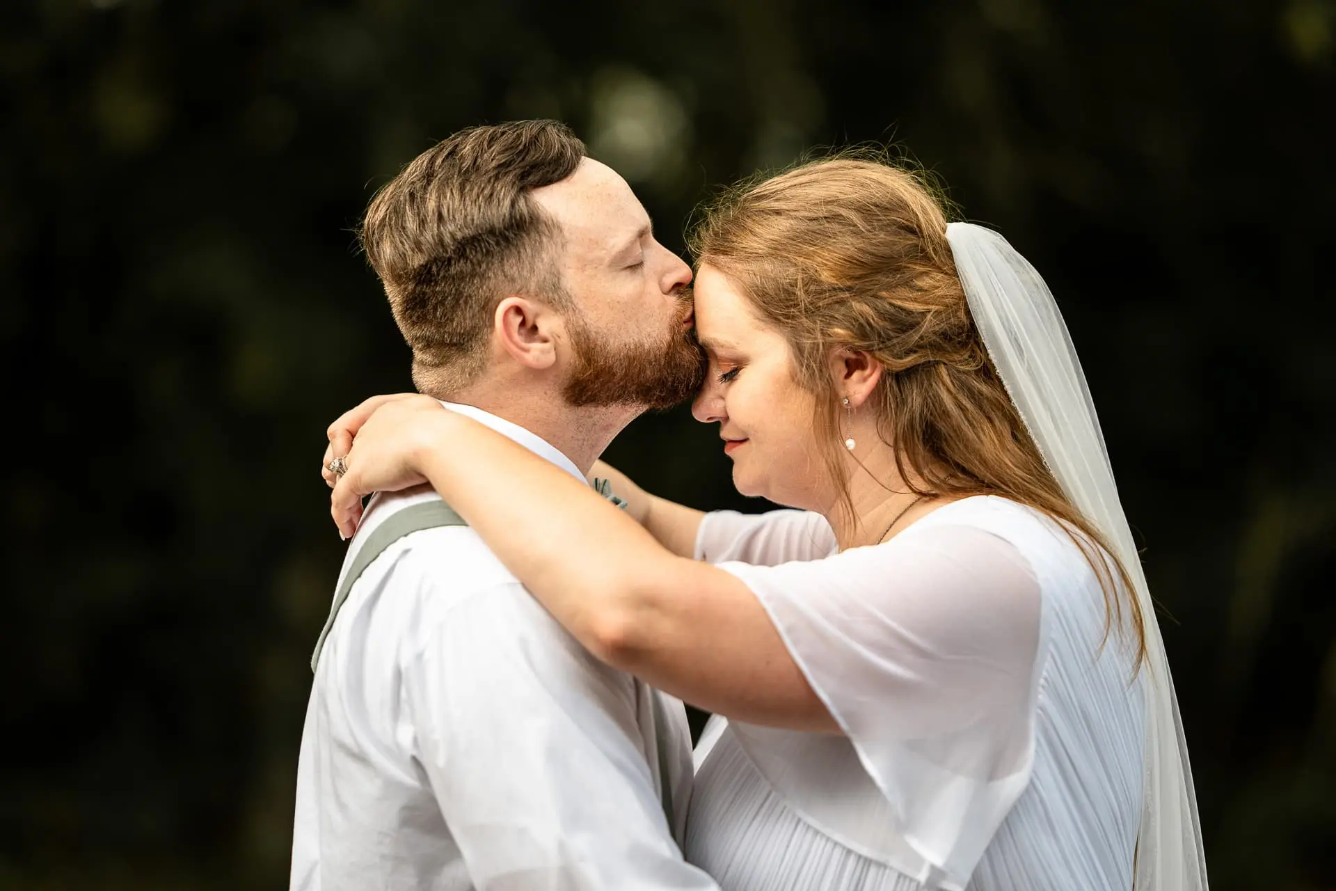 groom kissing bride