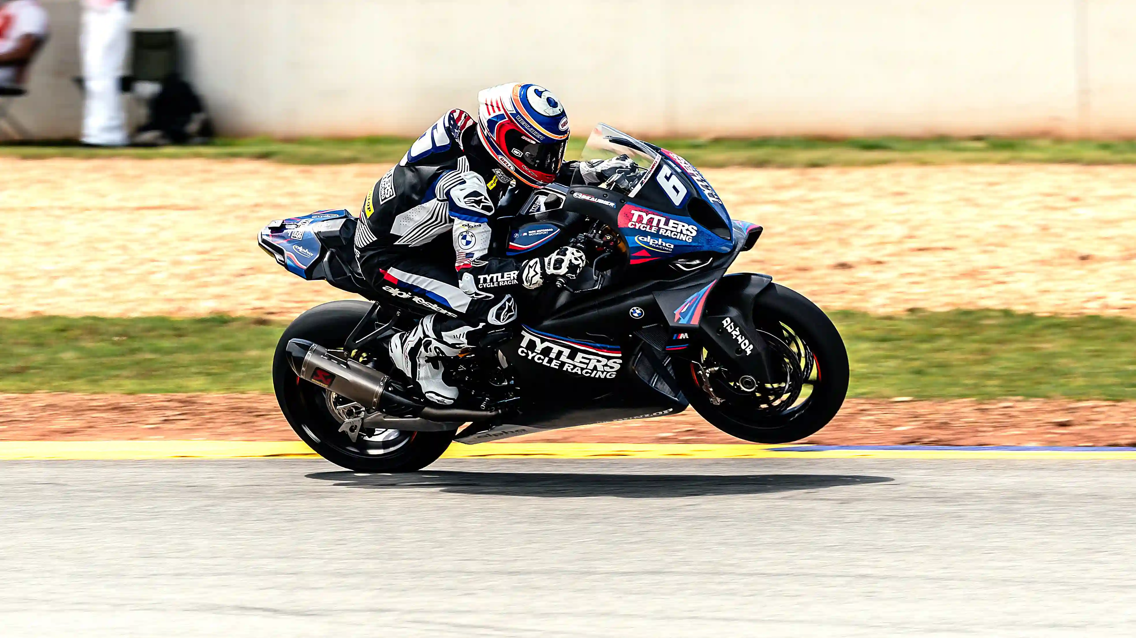 Motorcycle Racer Leaning Into A Turn photo in the Sports gallery
